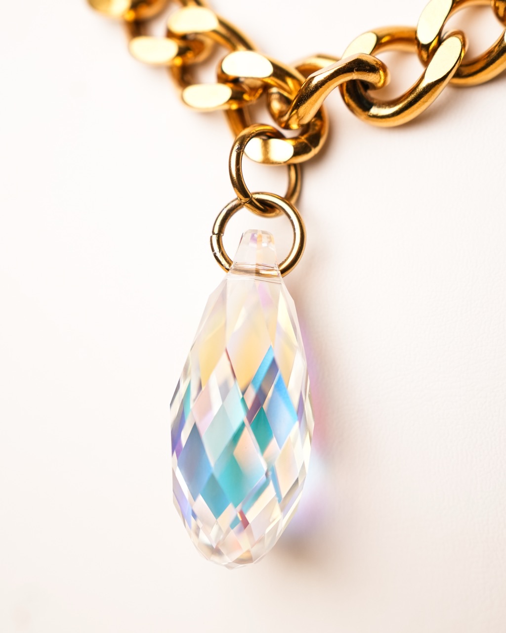 Aurora — iridescent crystal drop on a gold curb chain